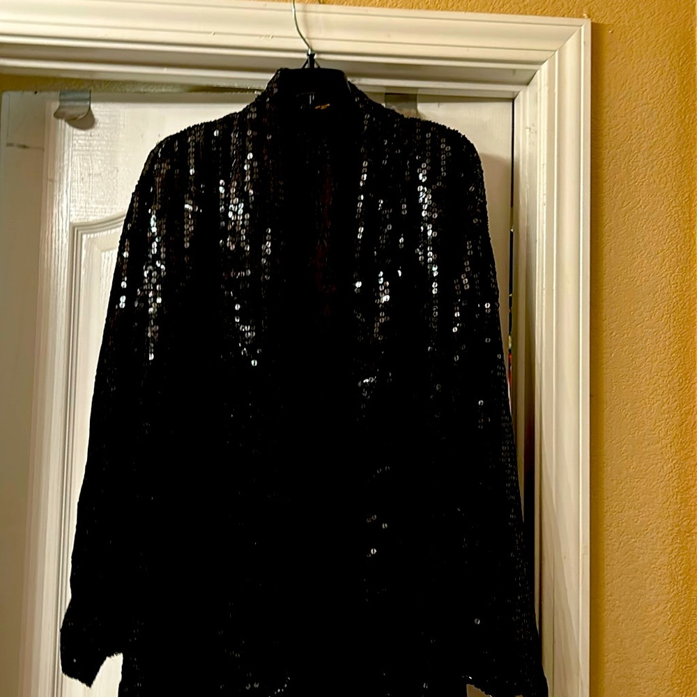 A black sequence evening jacket